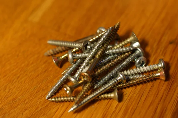 Closeup Shot Stack Metal Nails Wooden Table — Stock Photo, Image