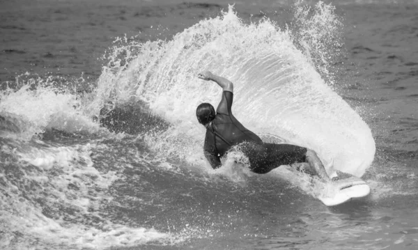 Grayscale Shot Surfer Board Wavy Sea — Stock Photo, Image