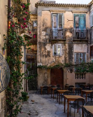 A small square among old buildings in Tropea historic centre, Calabria, Italy clipart