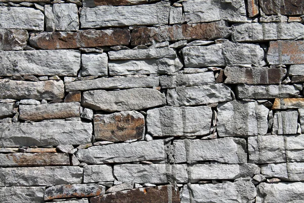 Een Closeup Van Een Stenige Muur Achtergrond — Stockfoto