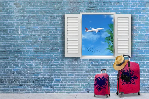 A 3D render of suitcases painted in Albanian flag colors with a summer hat and a camera and flying plane seen from an open window