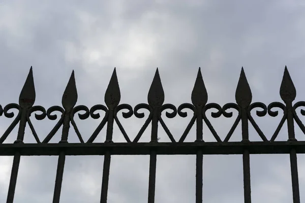 Silhouette Old Iron Gate Cloudy Sky — Stock Photo, Image
