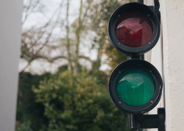 Selective Focus Shot Red Green Traffic Lights Attached Wall — Stock Photo, Image