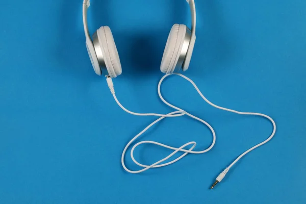 Closeup Shot White Headphones Blue Background — Stock Photo, Image