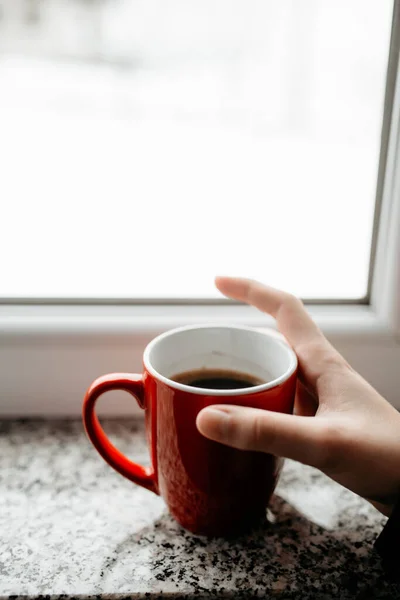 Vertical Shot Female Hand Holding Cup Hot Coffee Windowsill — Stock Photo, Image