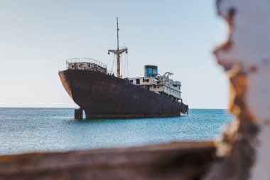 Old cargo ship aground on the shore of Lanzarote island, Canary Islands, Spain clipart