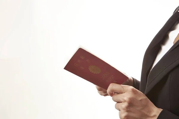 Крупный План Предпринимательницы Держащей Японский Паспорт Белом Фоне — стоковое фото