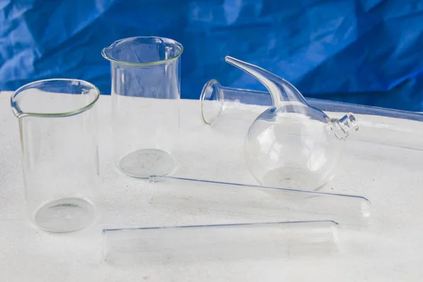 Closeup Laboratory Empty Glassware Blurred Background Blue Cloth — Stock Photo, Image