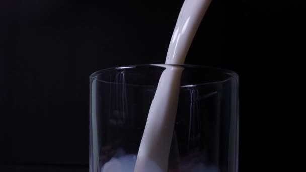 Pouring Water Glass Black Background — Stok video