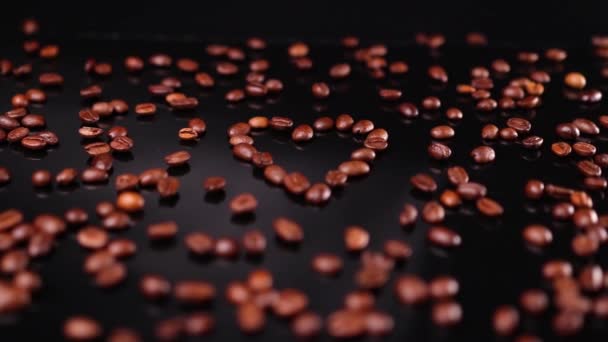 Brown Fresh Black Coffee Beans Form Heart Dark Background Romantic — Stock Video