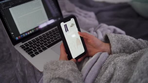 Young Woman Does Online Shopping Smartphone Bed Laptop Her Lap — Stock Video