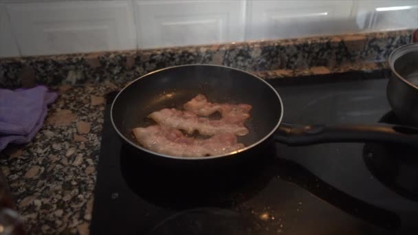 Closeup View Person Frying Slices Bacon Black Pan — Stock Video