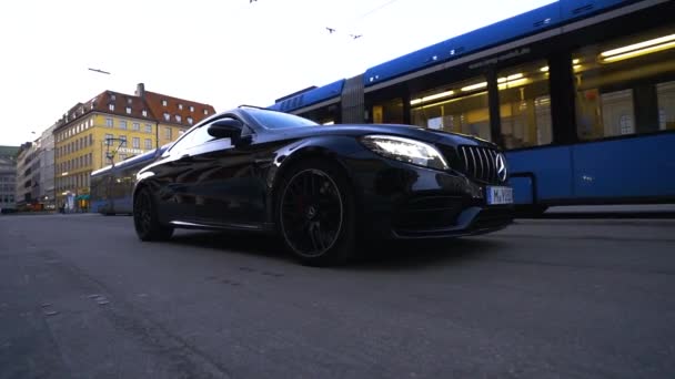 Slow Motion Mercedes Benz Sports Car Downtown Munich Streetcar Passes — Stock Video