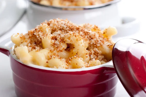 macaroni and cheese noodles in single serving size with breadcrumb topping