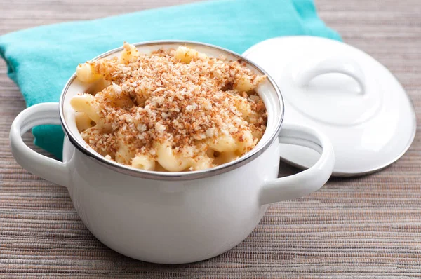 macaroni and cheese noodles in single serving size with breadcrumb topping