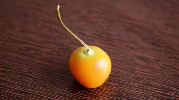 Beautiful Shot Yellow Tomato Wooden Surface — Stock video