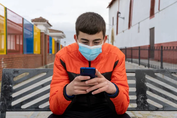 Stock Photo Young Boy Wearing Face Mask Due Covid19 Typing — Stock Photo, Image