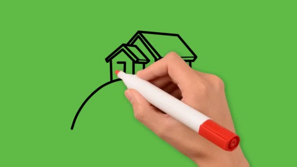 緑の背景に鉛筆画の家を持つ女性の手 — ストック動画