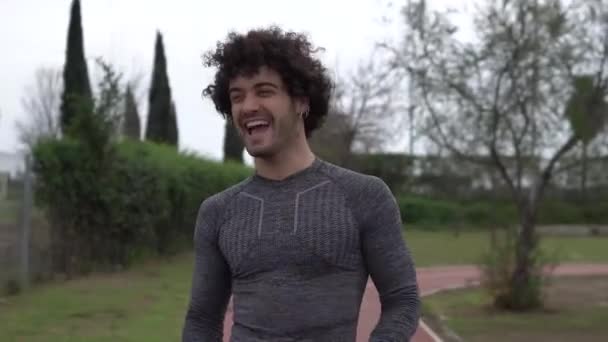 Handsome Curly Spanish Man Taking His Mask Laughing Wearing Back — Stock video