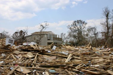 BILOXI, UNITED STATES - Sep 06, 2005: A wide angle shot of the destruction of buildings as a result of a hurricane clipart