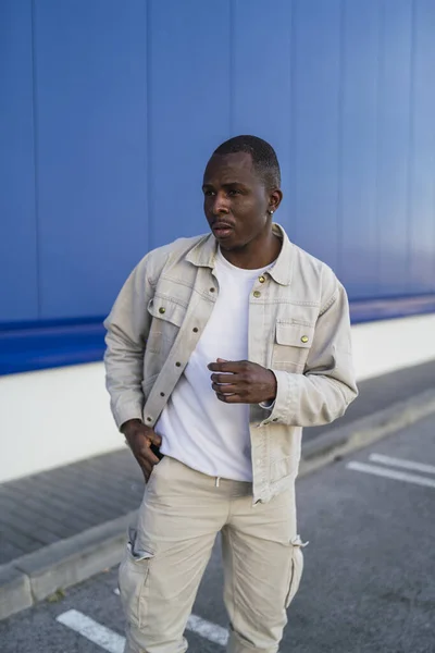 Vertical Shot Black Young Male Standing Front Blue Wall — Stock Photo, Image