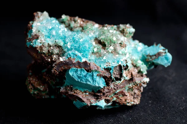 vibrant blue rosasite and calcite crystal mineral sample on granite