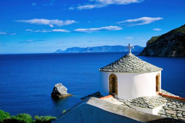 Beautiful white church on the Aegean Sea. Greece, Skopelos island , Holy Monastery of the Annunciation clipart