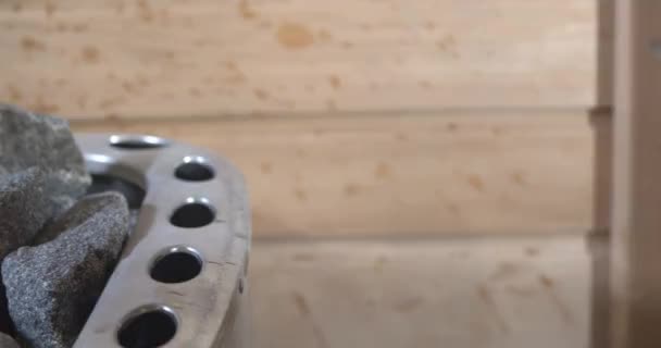 Closeup Water Pouring Sauna Rocks Footage — Stockvideo