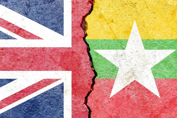 An illustration of the flags of the UK and Myanmar - politics conflicts concept