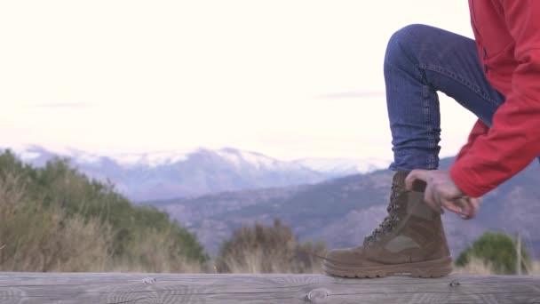 Closeup Shot Hiker Red Hoodie Tying Brown Boots Laces — Stockvideo