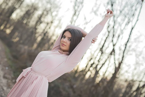 Young Caucasian Female Delicate Pink Dress Posing Road Forest Hands — Zdjęcie stockowe