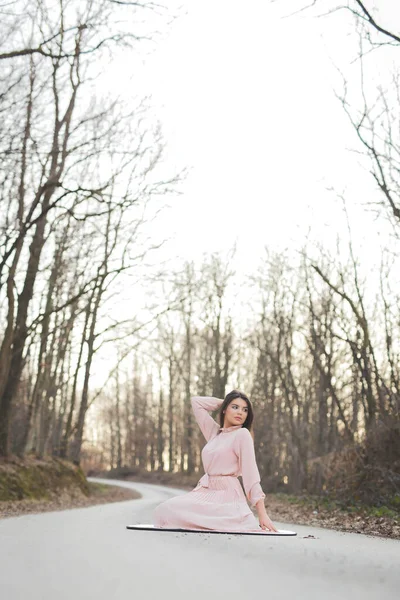 Young Caucasian Female Delicate Pink Dress Posing Sitting Road Forest — Stok fotoğraf