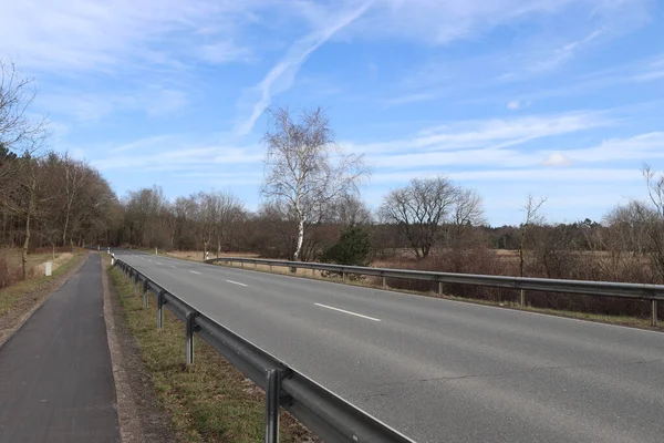 A perspective view on a European highway on a sunny day.