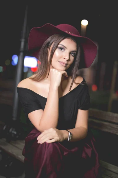 Vertical Shot Young Female Burgundy Skirt Hat Posing Street Night — Fotografia de Stock