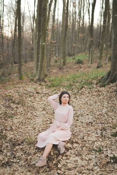 Young Caucasian Female Delicate Pink Dress Sitting Fallen Dry Trees — Zdjęcie stockowe