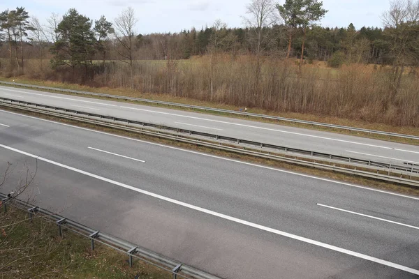 A perspective view on a European highway on a sunny day.