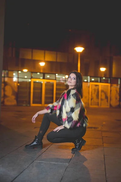 Vertical Shot Young Female Fashionable Jacket Posing Squatted Street Night — Photo