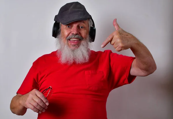 Caucasian Male Listening Music Headphones Making Funny Gestures — Zdjęcie stockowe