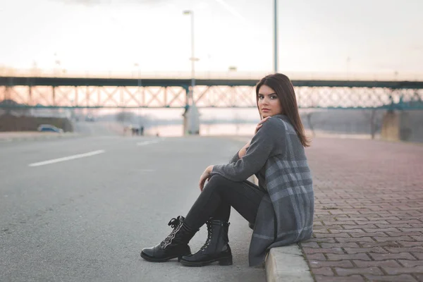 Young Caucasian Female Sitting Sidewalk — стоковое фото