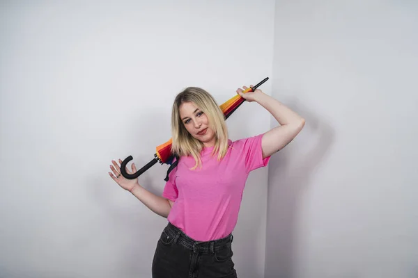 Happy Spanish Female Pink Shirt Holding Rainbow Umbrella White Background — Stockfoto