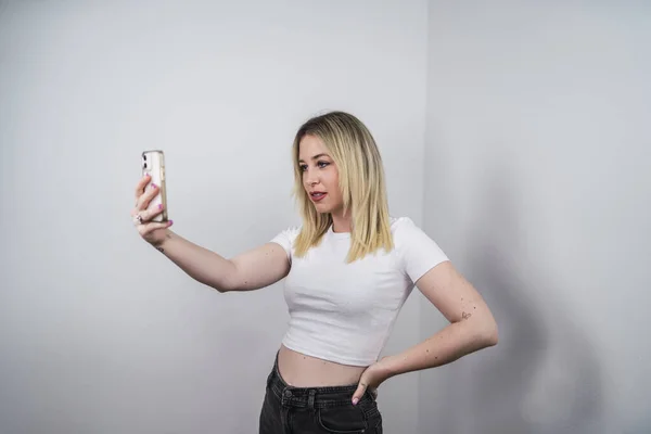 Stylish Spanish Female Taking Selfie White Background — Foto de Stock