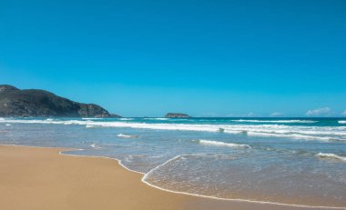 A beautiful view of a beach in Florianopolis, Santa Catarina, Brazil clipart