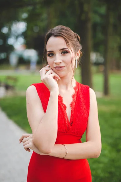 Elegant Caucasian Lady Wearing Red Dress Posing Outdoors — стоковое фото