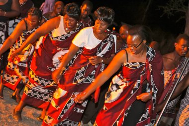 PRETORIA, SOUTH AFRICA - Apr 24, 2019: African dancers ethnic-cultural dancing ritual at the fire clipart