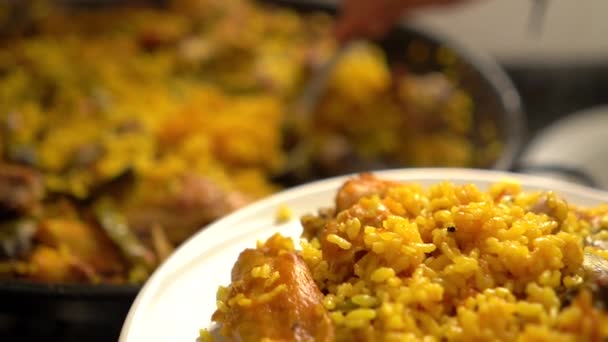 Appetizing Plate Valencian Paella Paellon Background While Cook Serves Rice — Stock Video