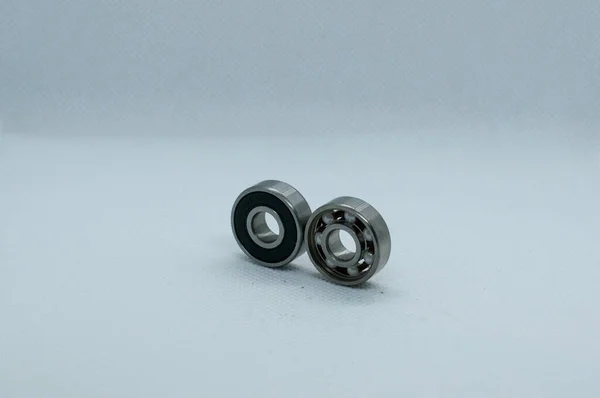 Closeup Two Isolated Metallic Ball Bearings Grey Background — Stock Photo, Image