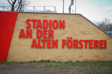 BERLIN, GERMANY - Apr 03, 2021: BERLIN, GERMANY April 03, 2021. The entrance sign and building of the 1. FC Union Stadion Football Club Berlin. clipart