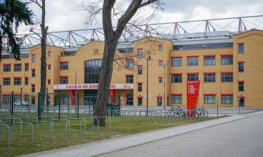 BERLIN, GERMANY - Apr 03, 2021: BERLIN, GERMANY April 03, 2021. The entrance sign and building of the 1. FC Union Stadion Football Club Berlin. clipart