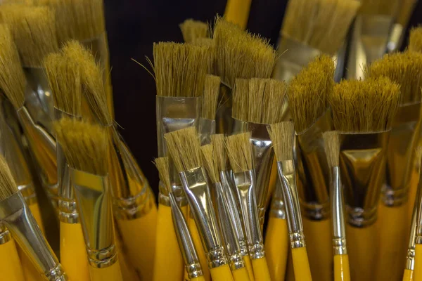 High Angle Shot Various Paintbrushes Different Sizes All Yellow Wooden — Stock Photo, Image