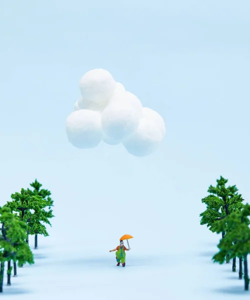 Clown Figurine Holding Umbrella Walking Trees Isolated Blue Background — Stock Photo, Image